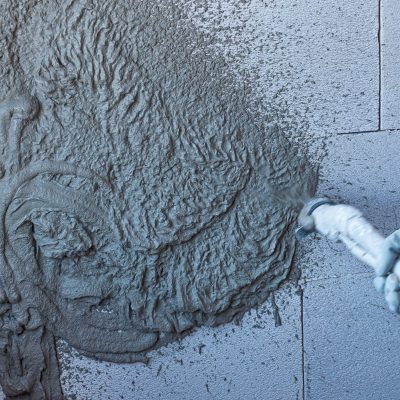 Plasterer,Using,And,Operating,Sprayer,Mortar,Equipment,Machine,For,Spraying